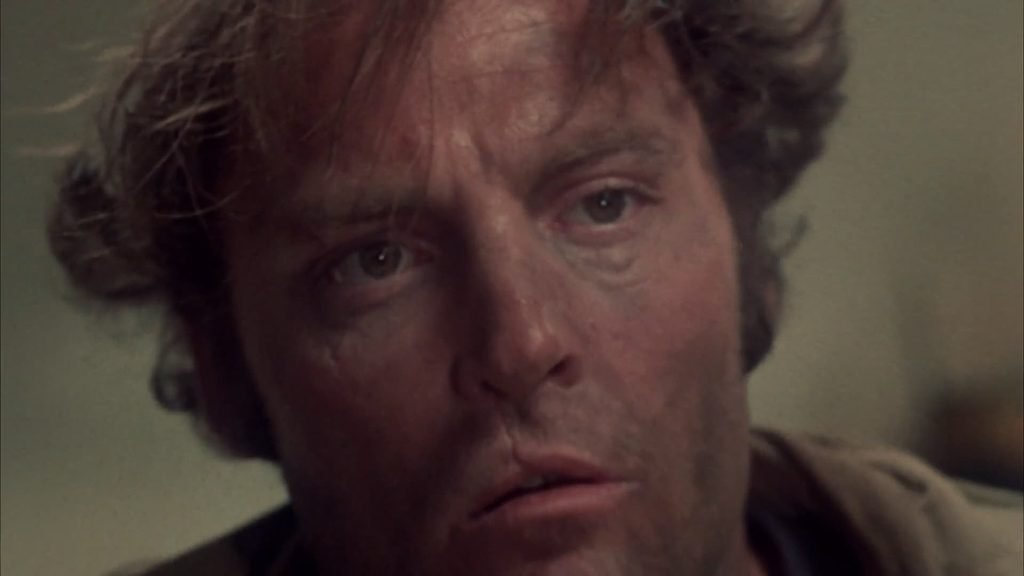 O ator Stacy Keach em cena do filme "Cidade das Ilusões", de John Huston.